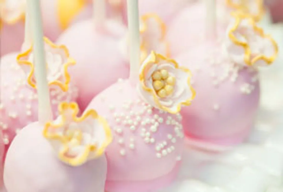 Pink and white decorated cake pops
